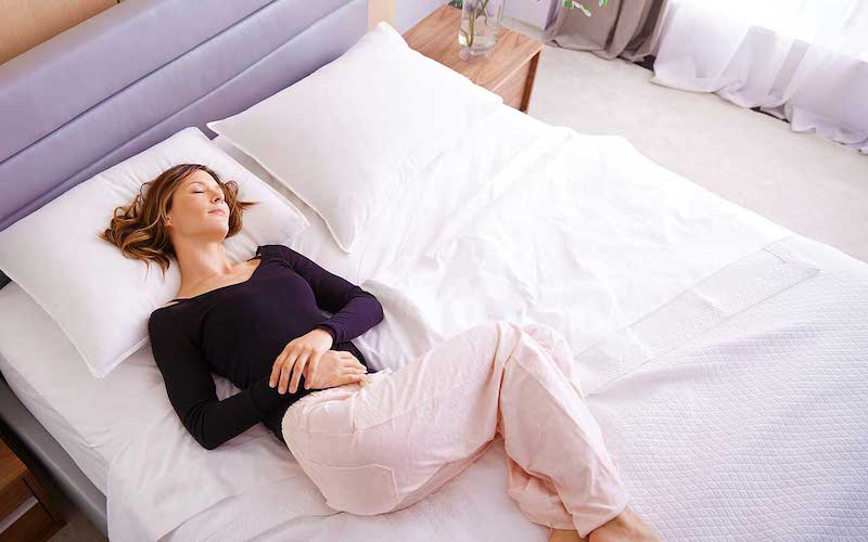 Woman sleeping peacefully on a Saatva mattress