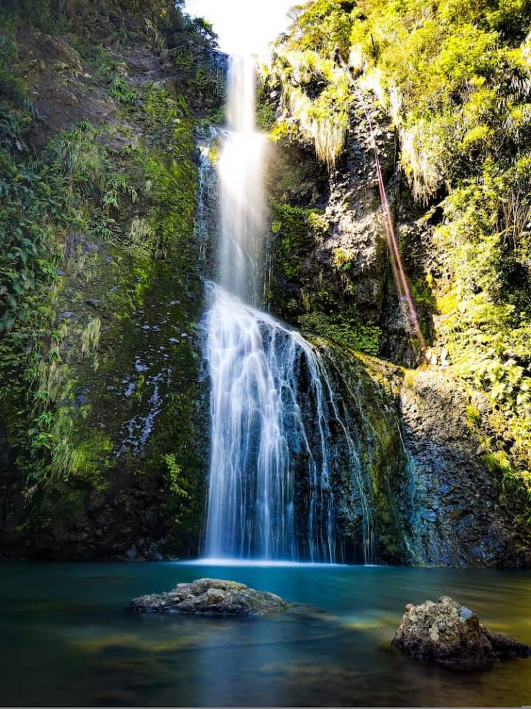 environmental personhood is whose responsibility? Image shows a waterfall in stunning nature