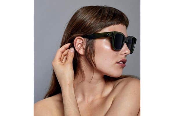 Brunette woman wearing Just Human ethical sunglasses
