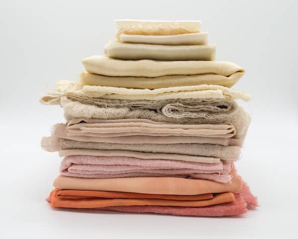 a pile of post-consumer waste textiles to be recycled