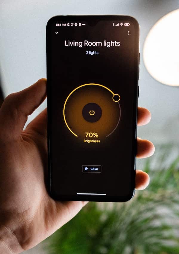 view of a smartphone with the home lighting control system on the screen