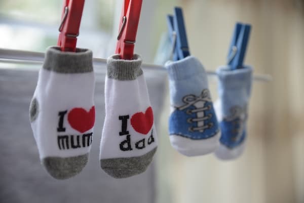 kids socks being air-dried on a clothesline indoors