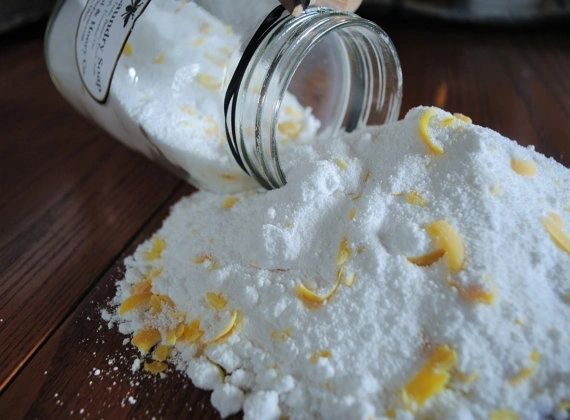 glass jar with spilled biodegradable detergent powder