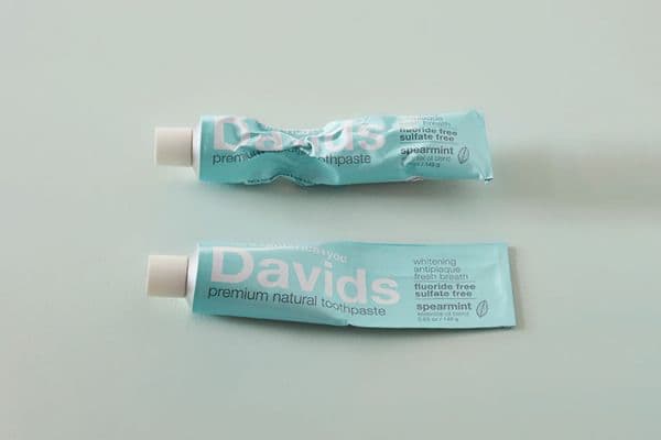 Two tubes of Davids natural toothpaste
