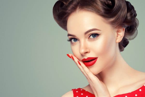 woman in red with gorgeous skin, showcasing vintage beauty tips and tricks
